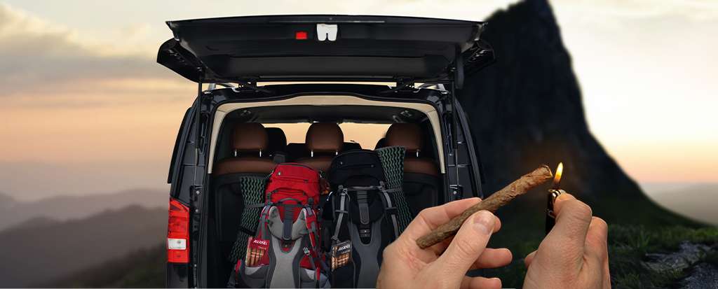 Holding an Avanti Cigar while on a Road Trip